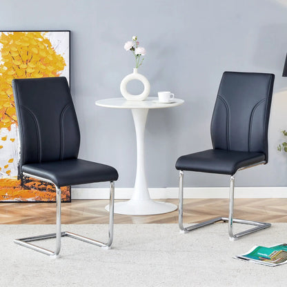 Two black high-back dining chairs with chrome cantilever legs around a white table Unique Piece on Tampa Home & Garden Store