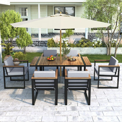 7-Piece outdoor dining set with table and removable gray cushions under beige umbrella on Tampa Home & Garden Store