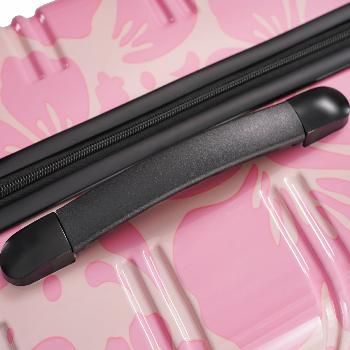 Pink hardshell luggage with black zipper and handle on Tampa Home & Garden Store