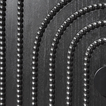 Black bead strands with round beads on textured dark wood surface on Tampa Home & Garden Store