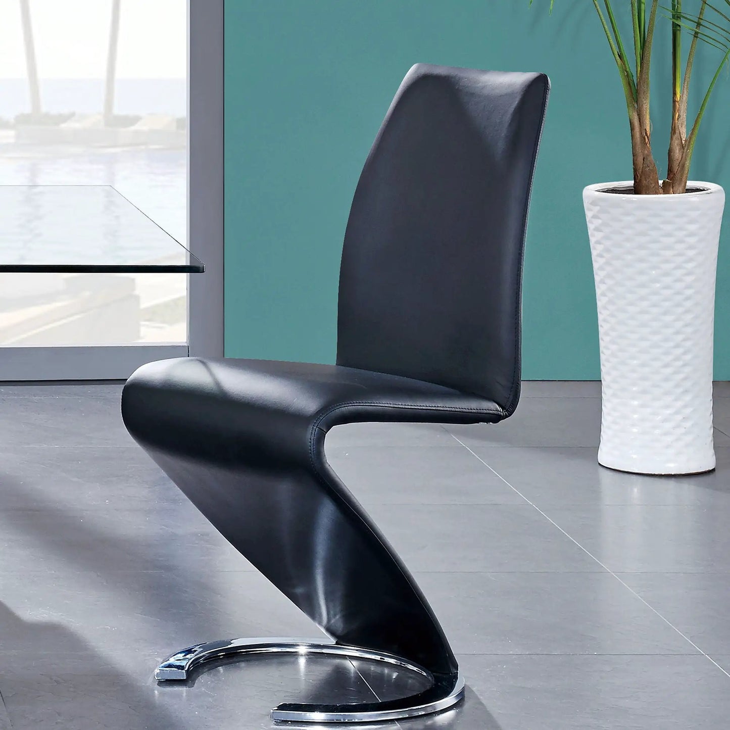 Marcus Horseshoe Dining Chairs set of 2 in black leather with curved chrome base on Tampa Home & Garden Store