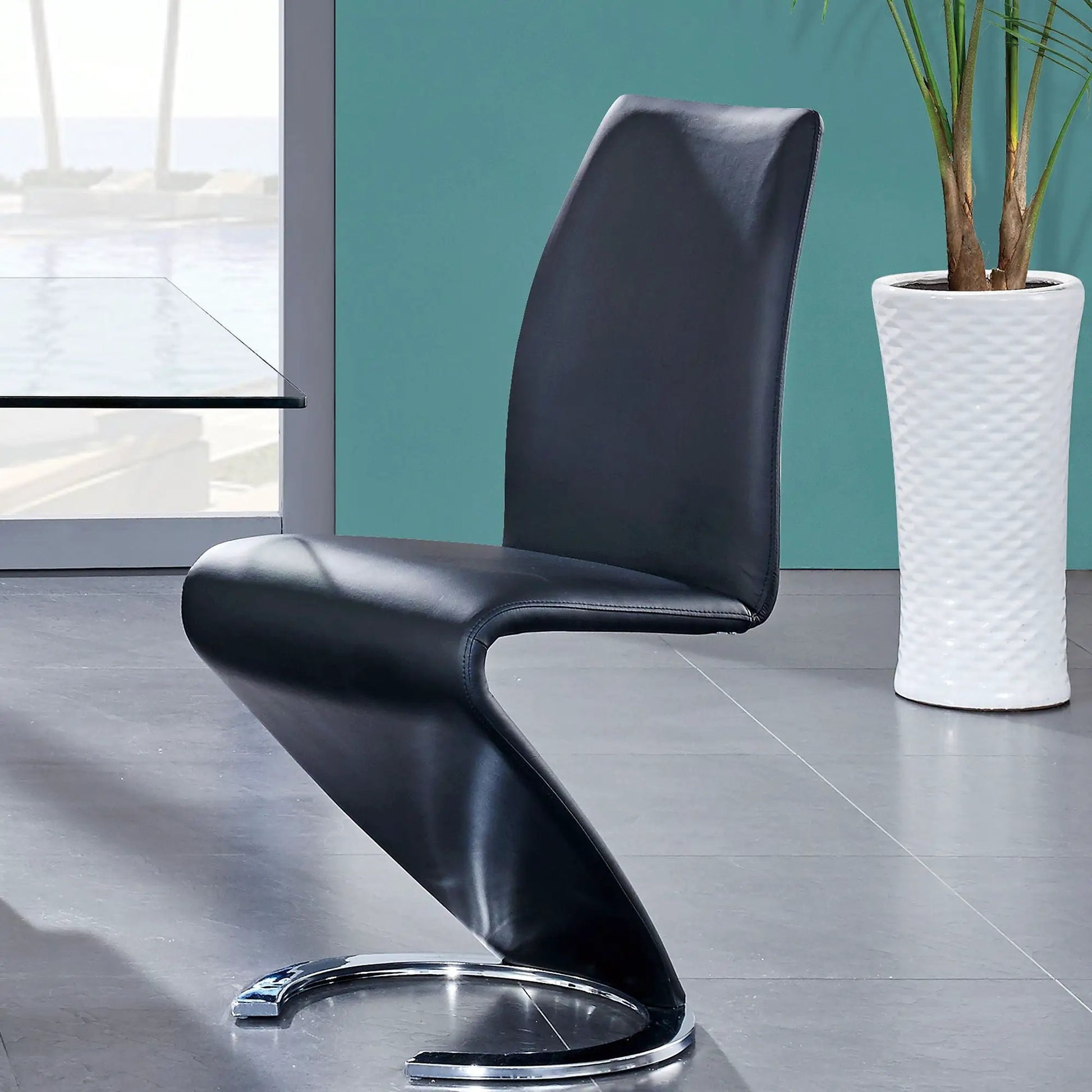 Marcus Horseshoe Dining Chairs set of 2 in black leather with curved chrome base on Tampa Home & Garden Store