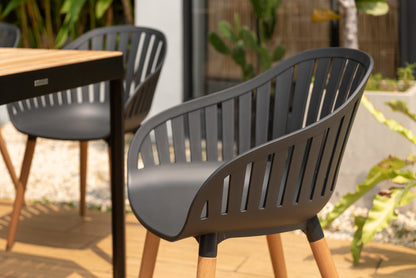 Portals dark rectangular teak table with 8 Nassau black dining chairs outdoor patio set on Tampa Home & Garden Store