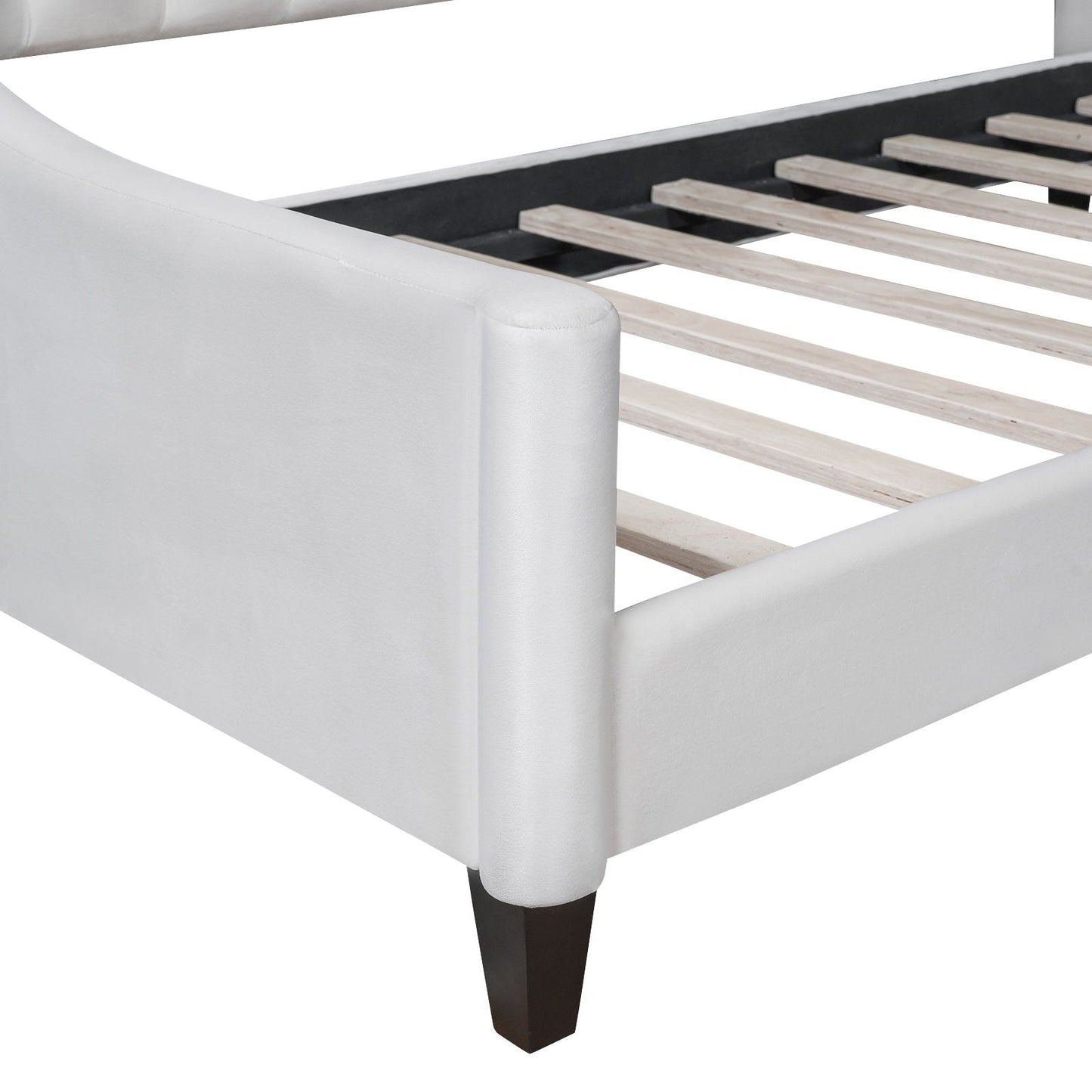 Modern tufted daybed in white faux leather with dark wood legs and slatted base on Tampa Home & Garden Store