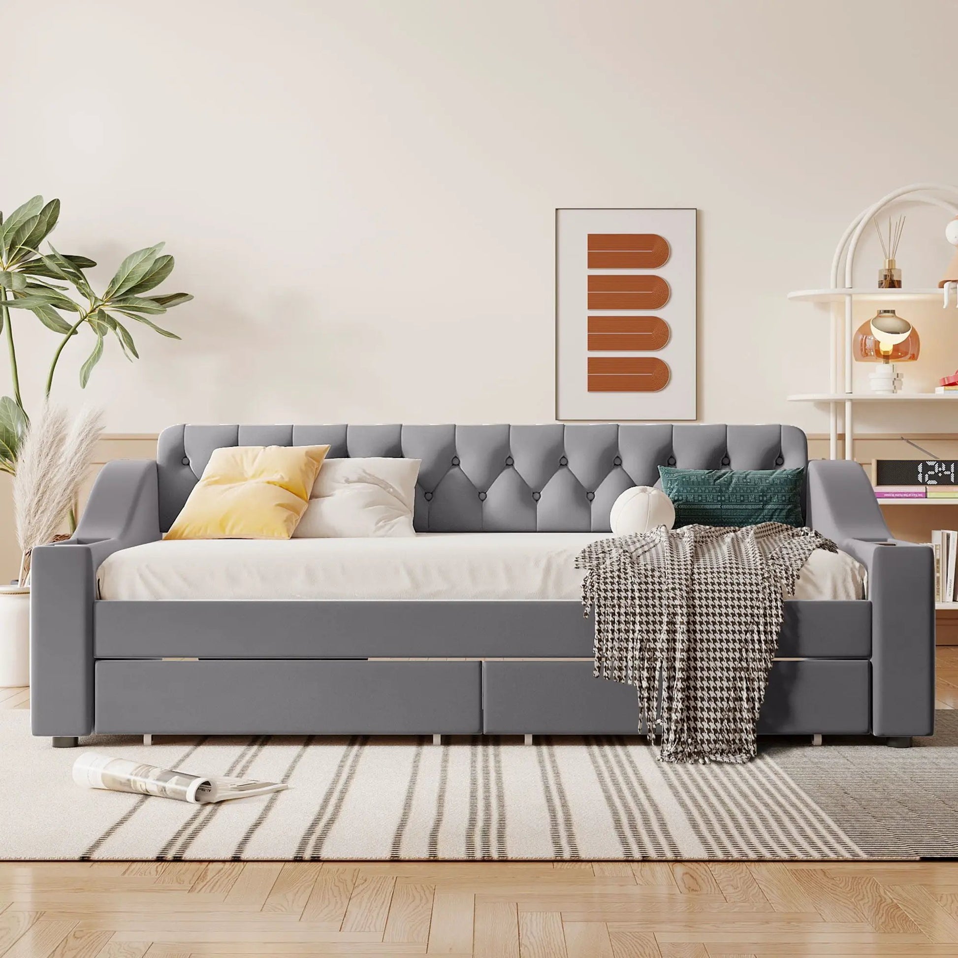 Upholstered gray daybed with tufted back and built-in storage drawers, yellow pillows on Tampa Home & Garden Store