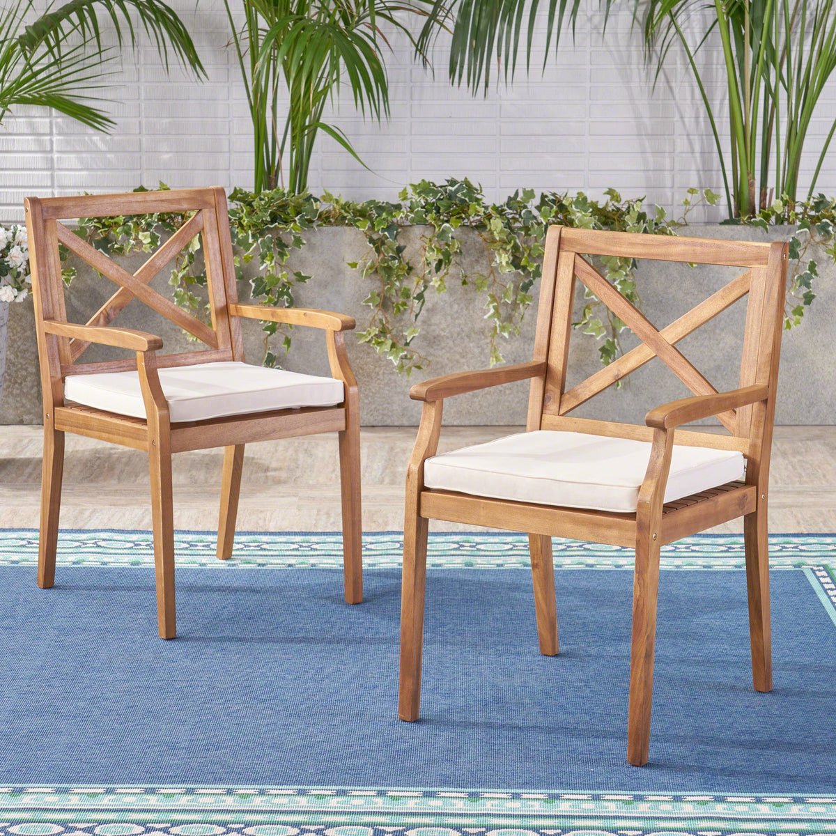Perla outdoor dining chairs 2-piece set in wood with cream water-resistant cushions on Tampa Home & Garden Store