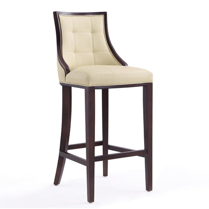 White bar height stool with solid wood frame, beige tufted upholstery, dark brown legs on Tampa Home & Garden Store