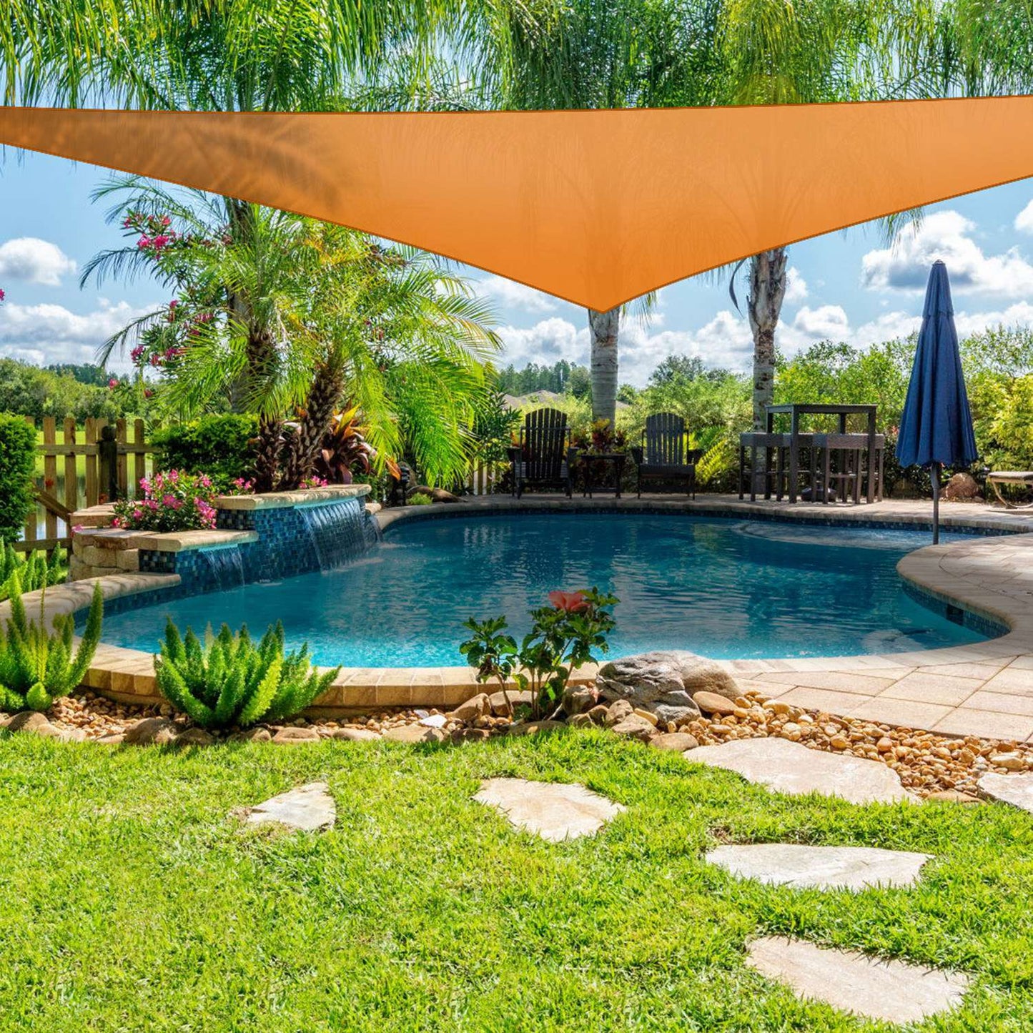 GemGear orange triangle shade sail over a backyard pool with palm trees and outdoor furniture on Tampa Home & Garden Store
