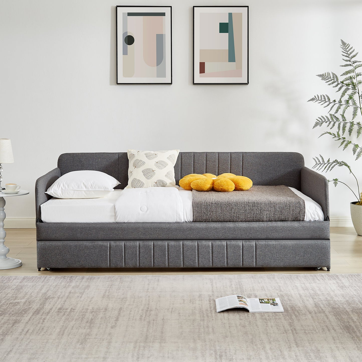 Daybed sofa bed with trundle twin size in dark gray fabric with white bedding on Tampa Home & Garden Store