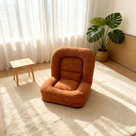 Egg Tart Lazy Sofa folding bean bag chair in orange fabric beside a plant on Tampa Home & Garden Store