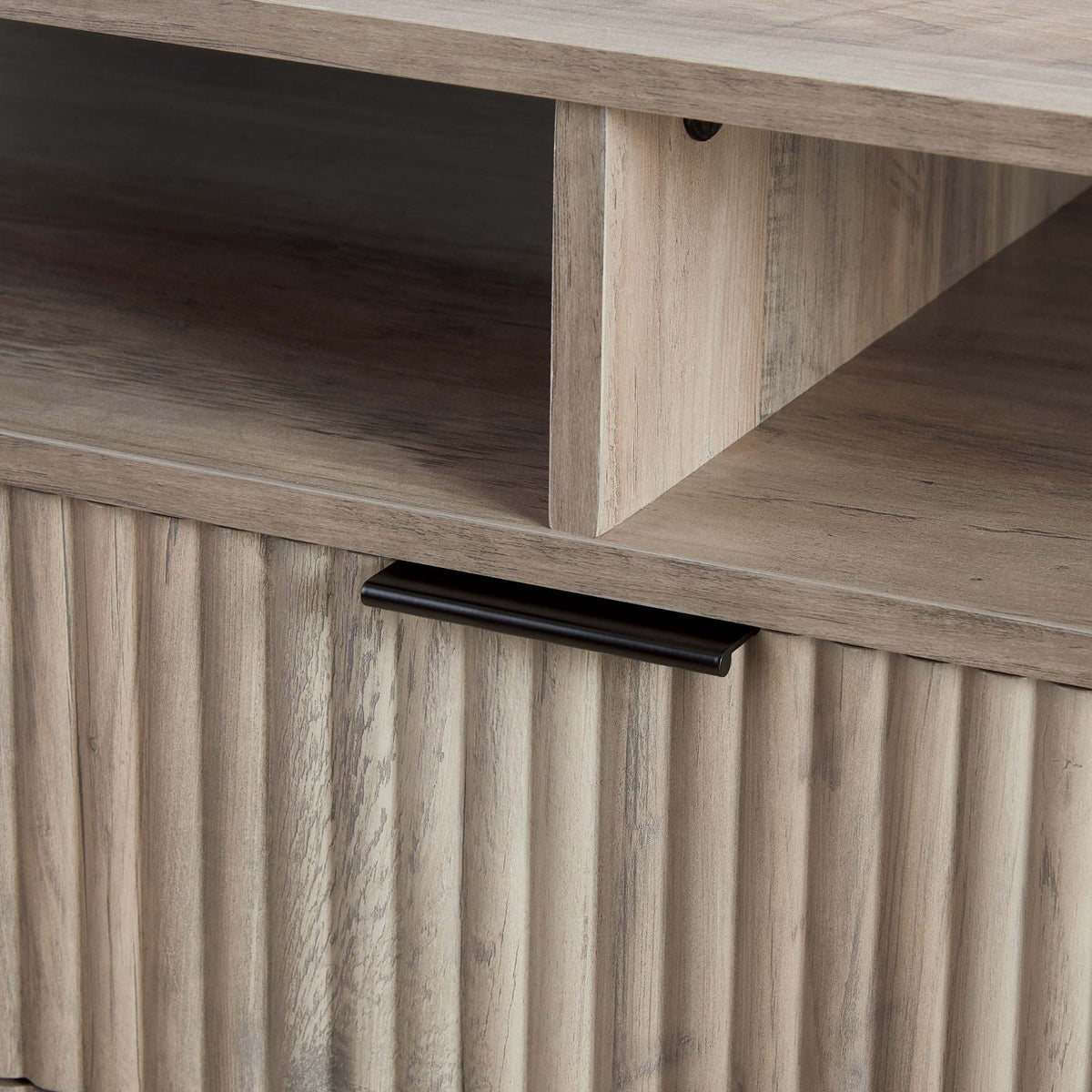 Fluted TV stand with storage in weathered gray wood finish, black metal handle hardware on Tampa Home & Garden Store