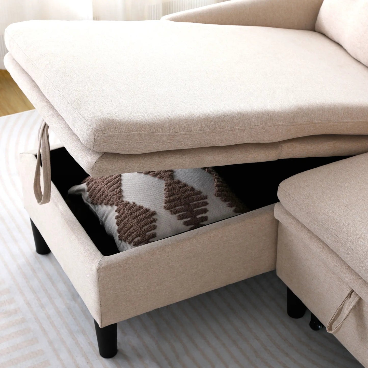 L-shaped reversible chaise sectional sofa in beige fabric with black legs on Tampa Home & Garden Store