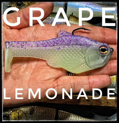 4.5 inch Nacho boot-tail soft swimbait by Bull Shad Swimbaits in grape lemonade glitter on Tampa Home & Garden Store