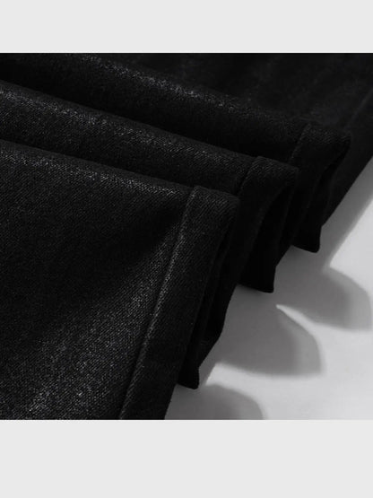 Men's vinyl-coated bootcut trousers in black denim-like fabric with visible stitching on Tampa Home & Garden Store