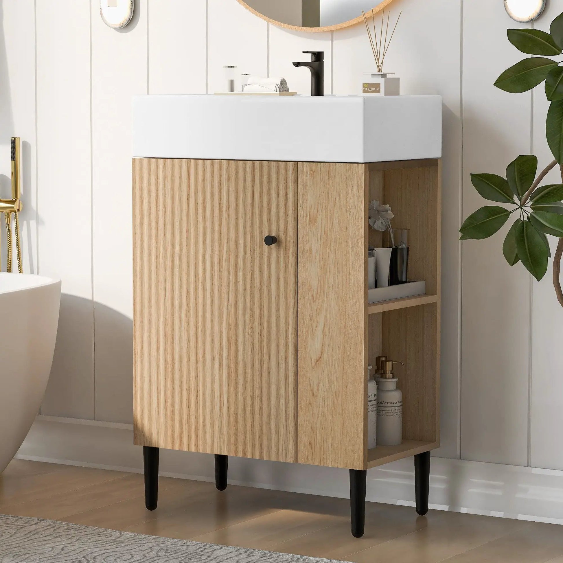 Single ceramic sink vanity atop oak cabinet with open storage and black tapered legs on Tampa Home & Garden Store