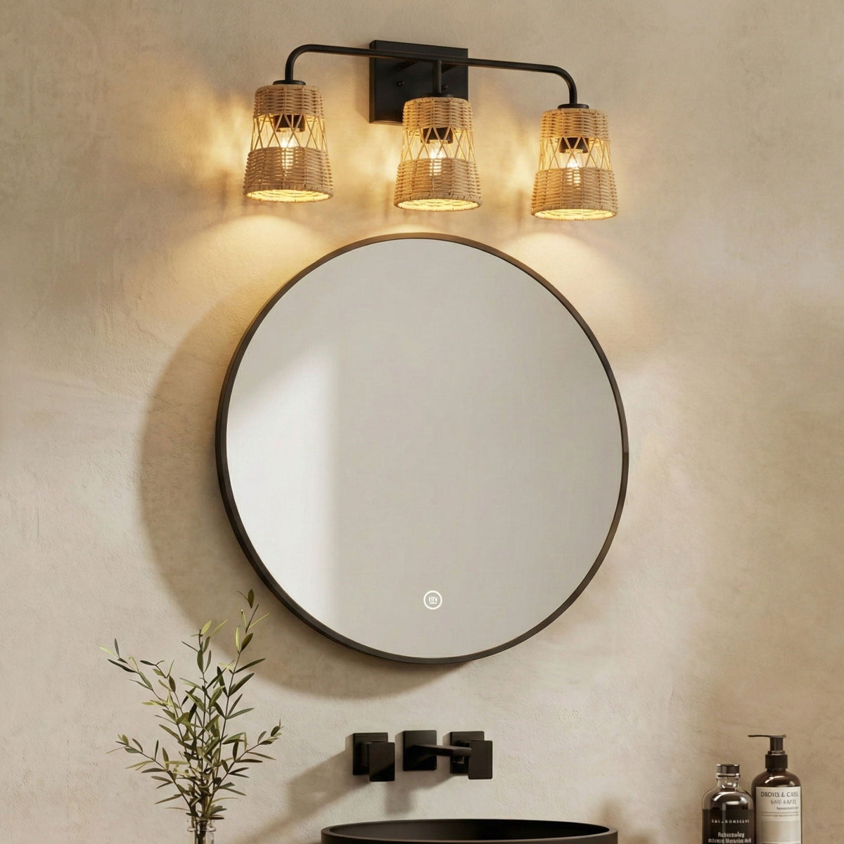 Moonlit 3-light wall sconce with woven wicker shades on a black metal bar above a round mirror on Tampa Home & Garden Store