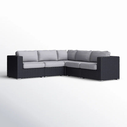 Luxurious wicker patio sectional with Sunbrella cushions, L-shaped sofa in dark charcoal weave on Tampa Home & Garden Store