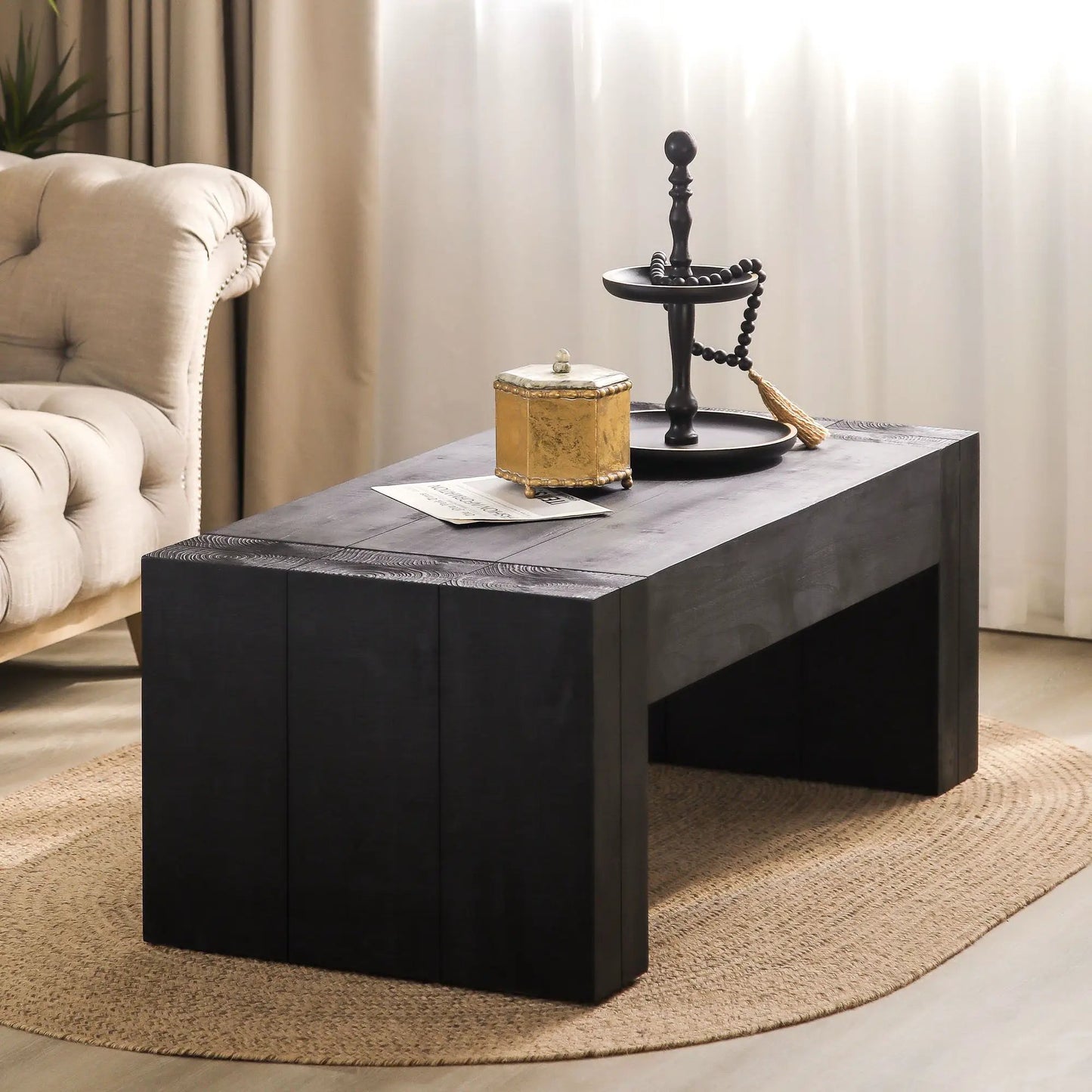 Minimalist rectangular coffee table in dark wood with gold box and beaded necklace on Tampa Home & Garden Store