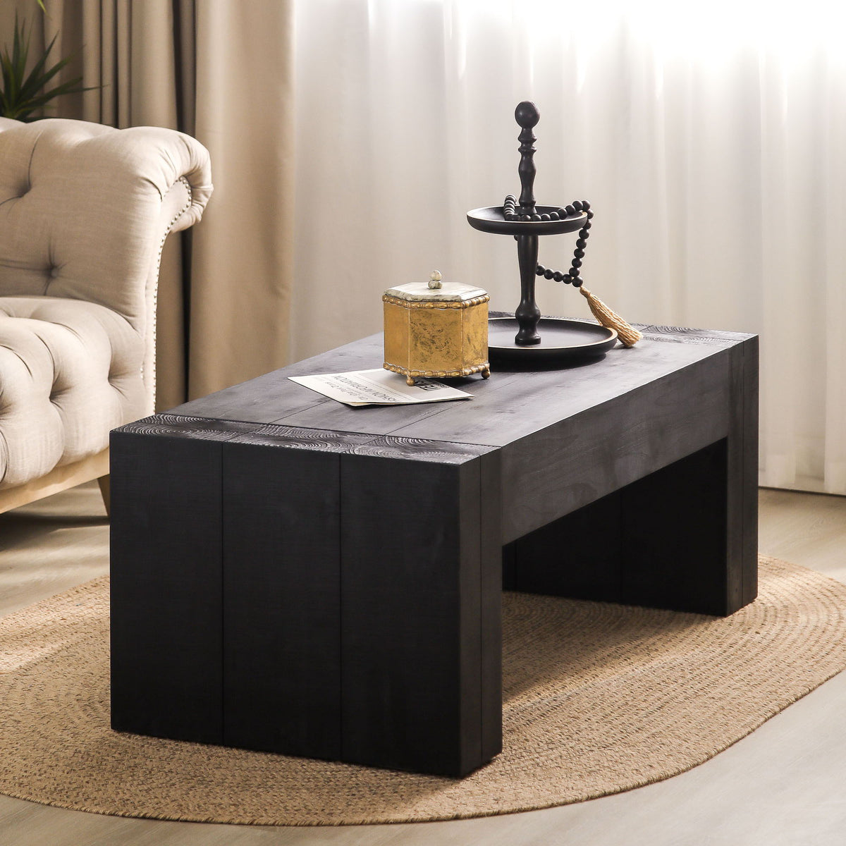 Minimalist rectangular coffee table in black wood with chunky legs for a modern living room on Tampa Home & Garden Store