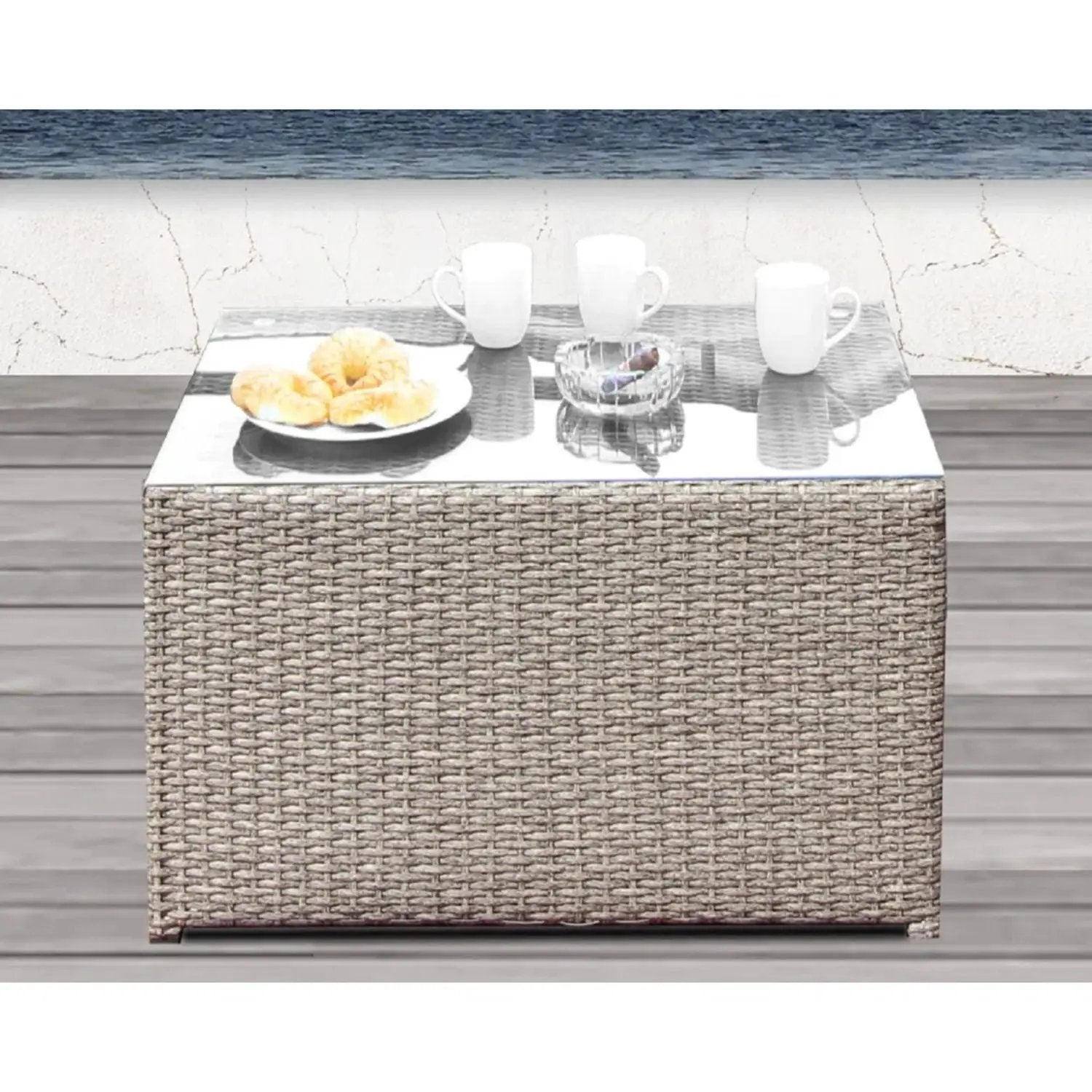 Outdoor wicker rattan coffee table with glass top; white mugs and croissants on deck on Tampa Home & Garden Store