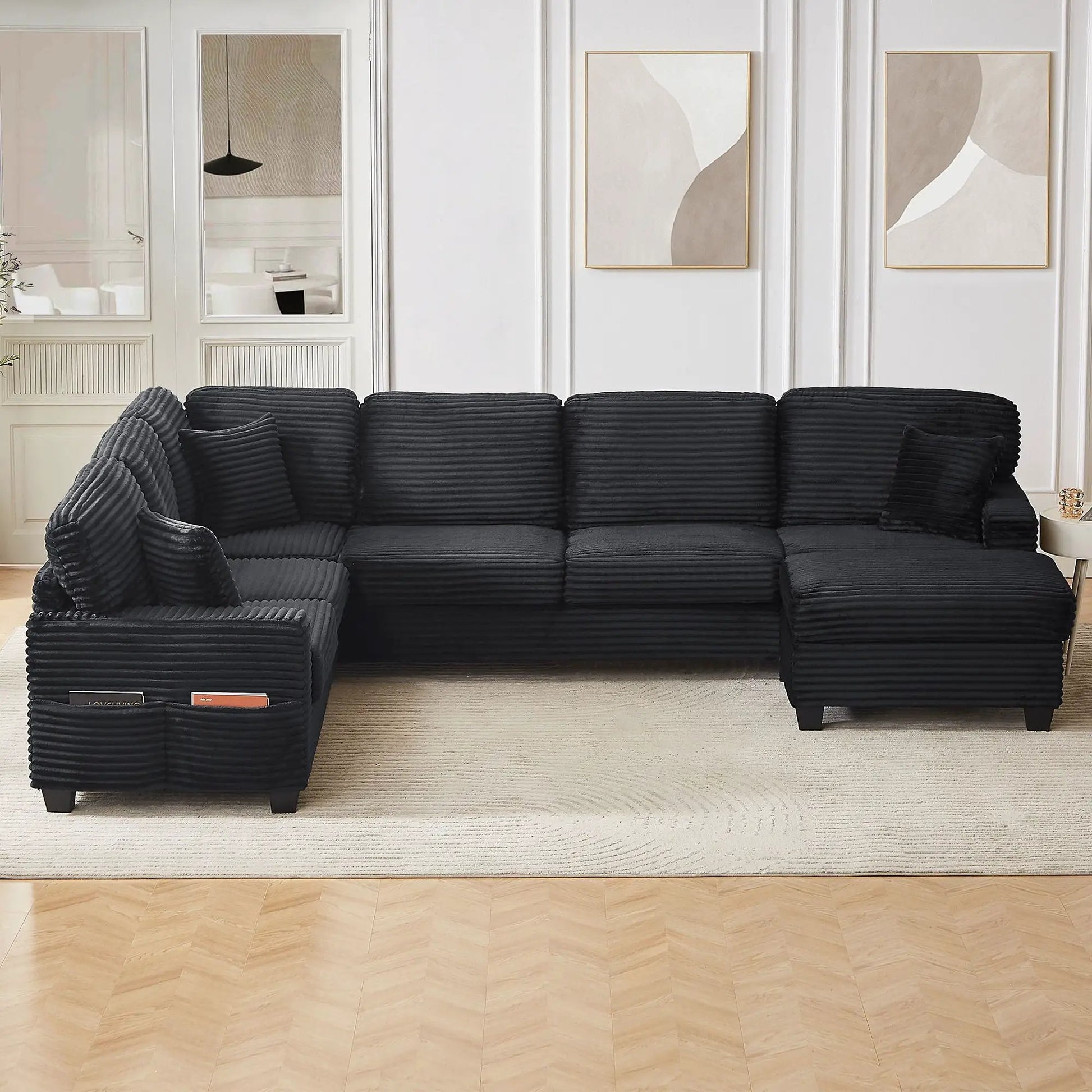 U-shaped black ribbed upholstered sectional with movable ottoman and side storage pockets on Tampa Home & Garden Store