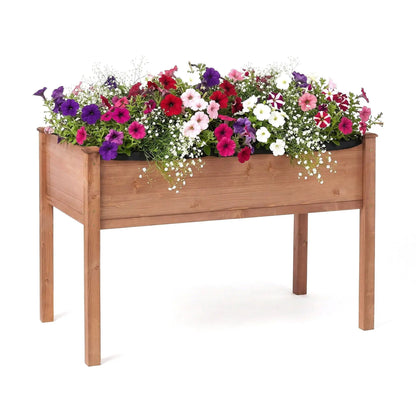 Elevated raised garden bed planter in natural wood with petunias by Unique Piece Furniture on Tampa Home & Garden Store