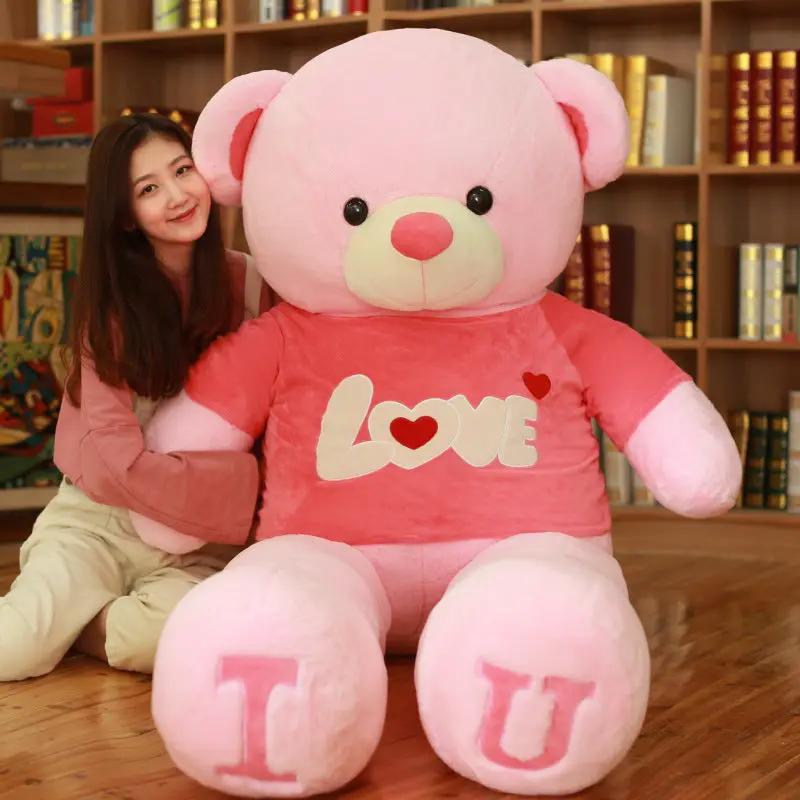 Heart Bear plush toy in pink with white LOVE graphic on the shirt and feet labeled T and U on Tampa Home & Garden Store