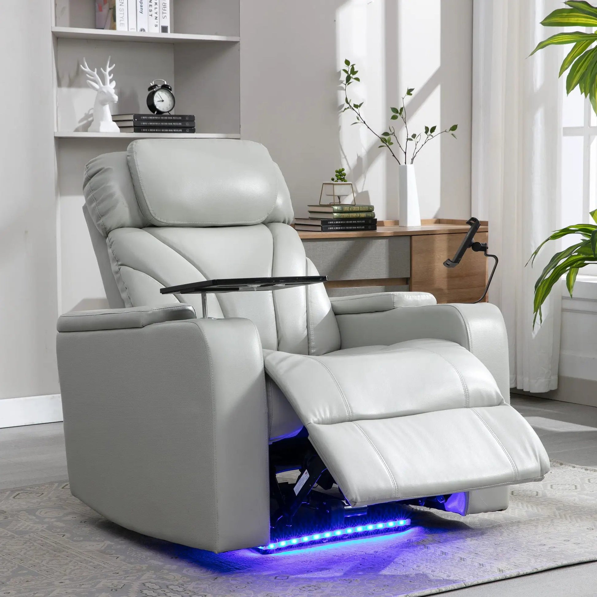 Power motion recliner in light gray leather with USB charging, hidden arm storage and cup holder on Tampa Home & Garden Store
