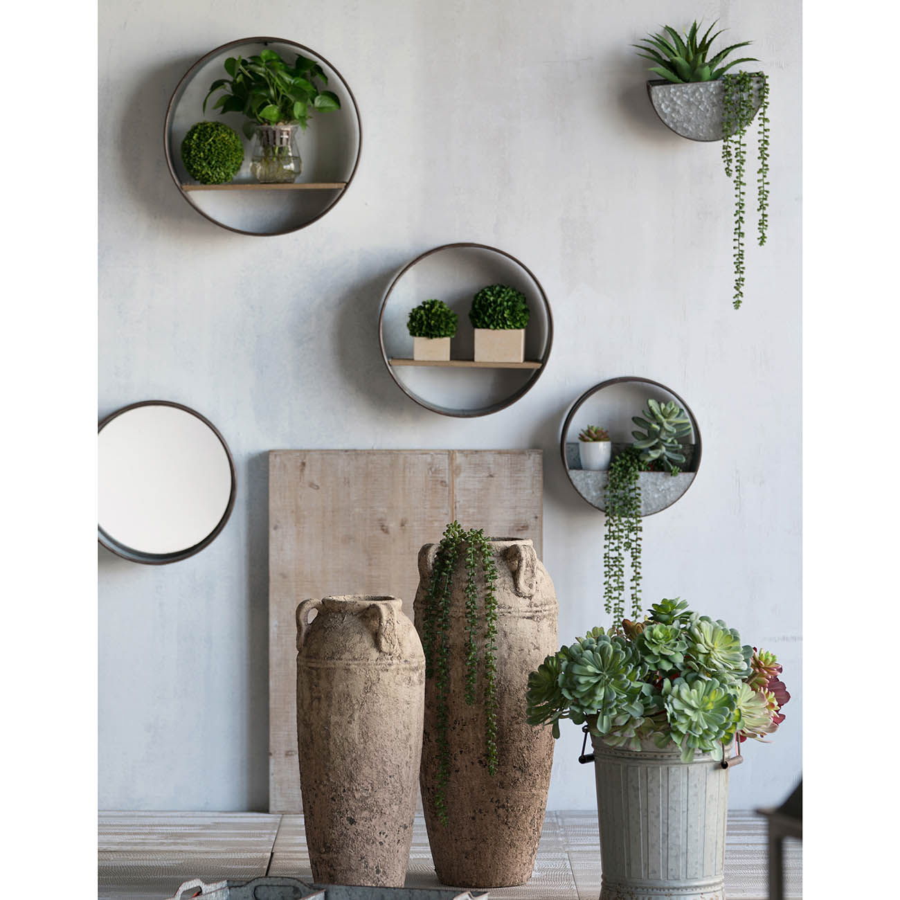 Farmhouse Round Metal Wall Planter Set of 5 gray; round wall shelves with plants on a light wall on Tampa Home & Garden Store