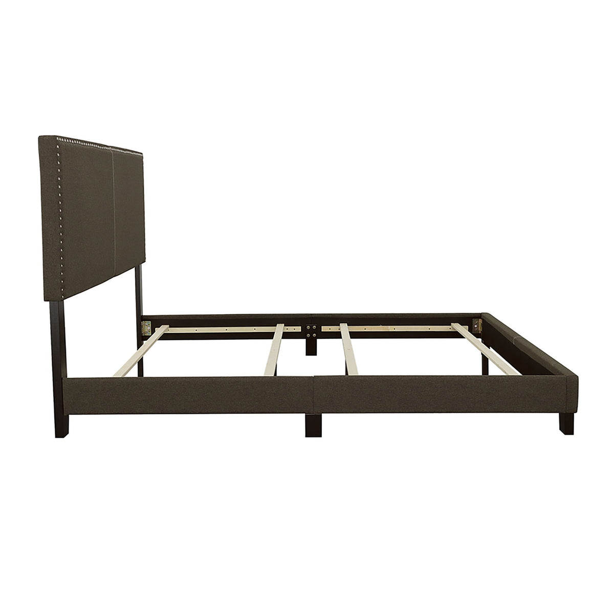 Queen bed with charcoal upholstered headboard featuring nailhead trim and metal legs on Tampa Home & Garden Store