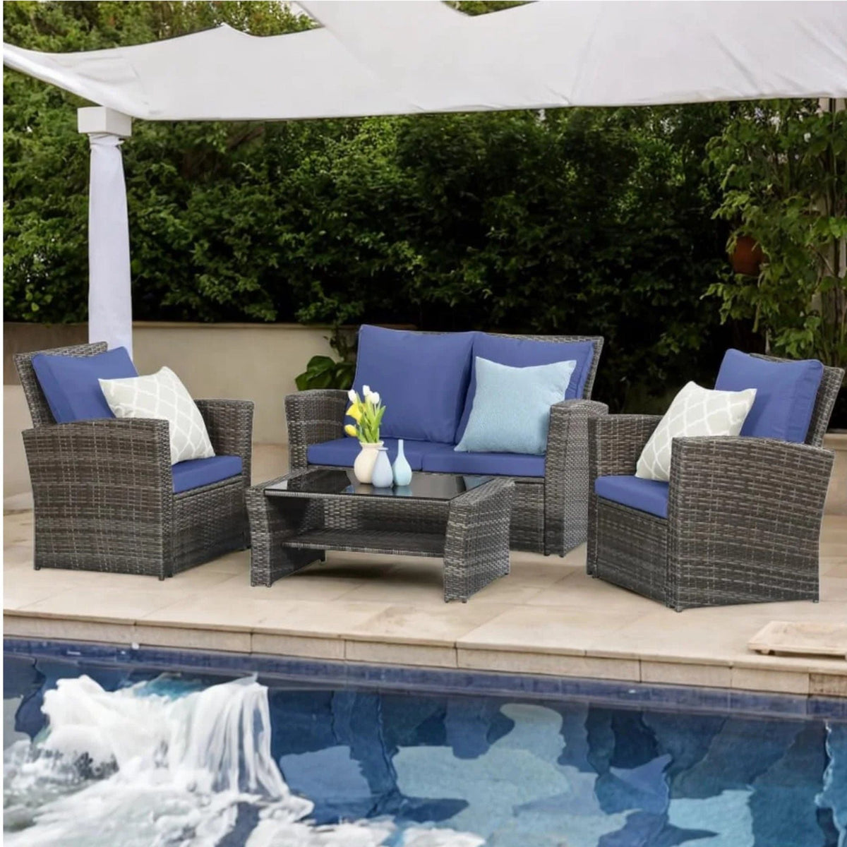 Modern patio furniture set 4-piece with blue cushions and wicker chairs around a table on Tampa Home & Garden Store