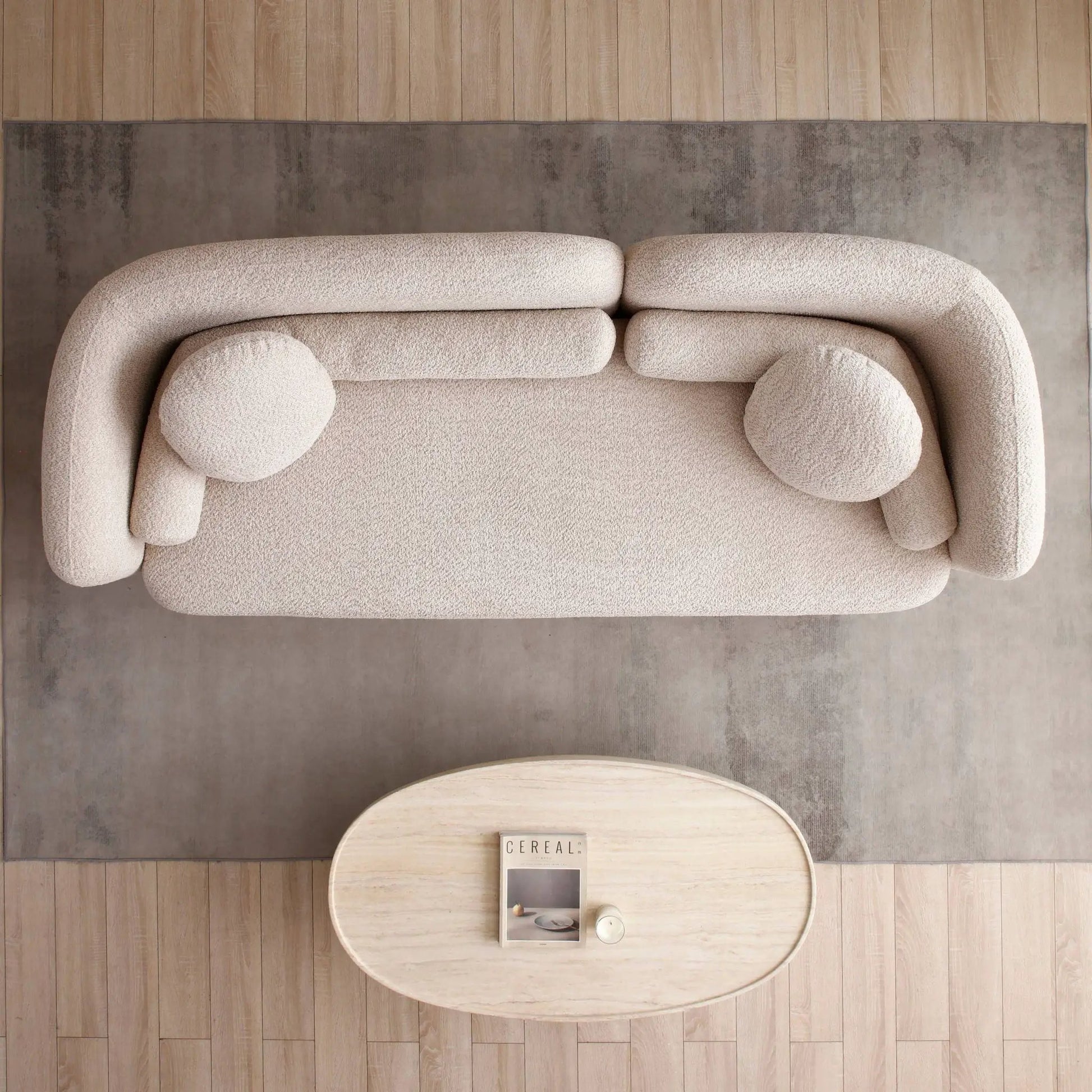 Luxury Modern 3 Seater Couch in beige boucle with rounded arms on gray rug on Tampa Home & Garden Store