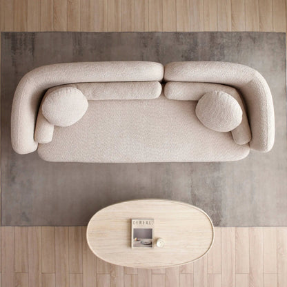 Luxury Modern 3 Seater Couch in beige boucle with rounded arms on gray rug on Tampa Home & Garden Store
