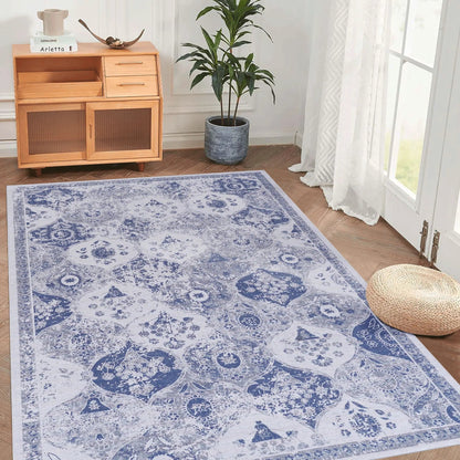Maval area rug in blue and white with ornate pattern in a bright living room beside a cabinet on Tampa Home & Garden Store