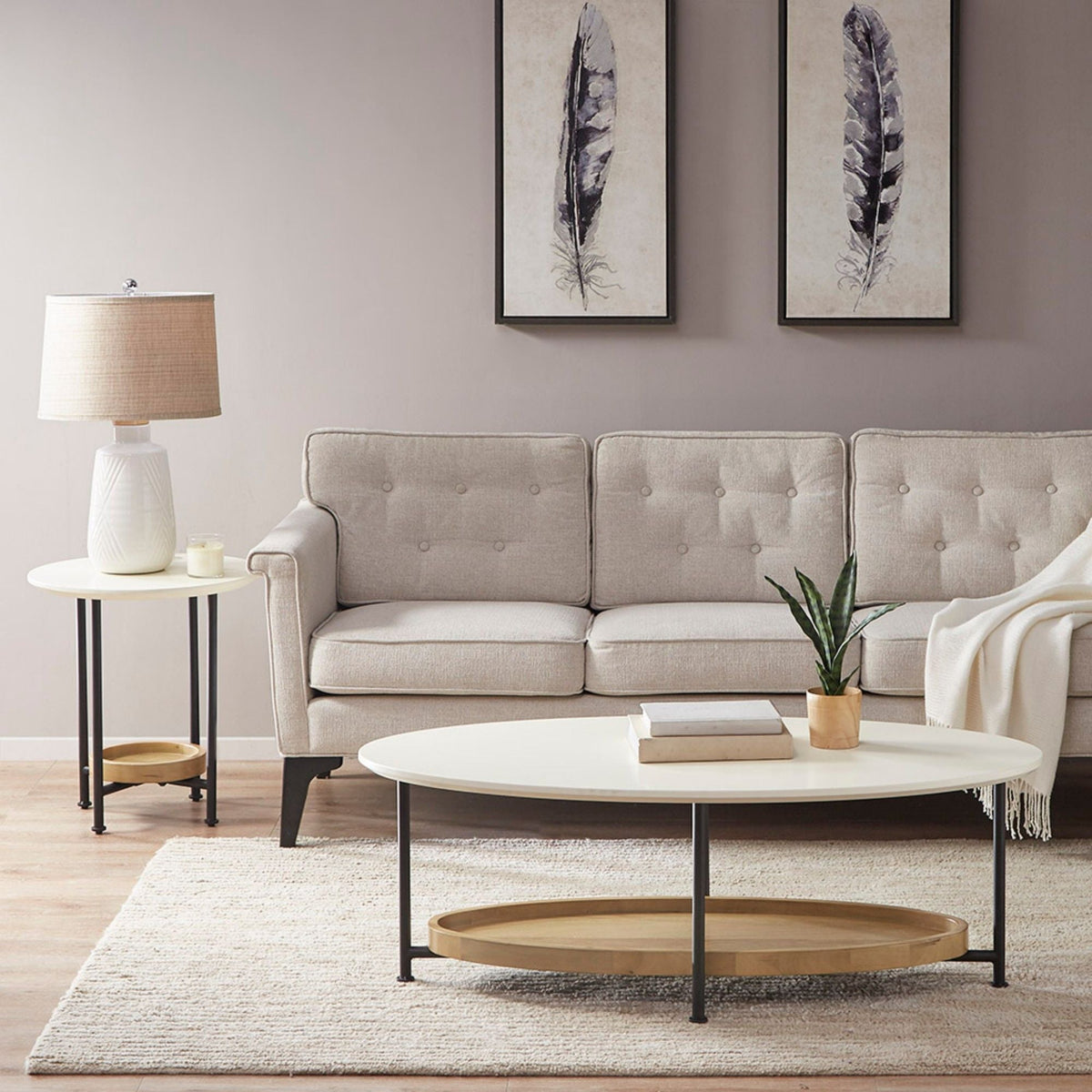 Two oval coffee tables with storage shelf, white tops, natural wood lower shelf, black legs on Tampa Home & Garden Store