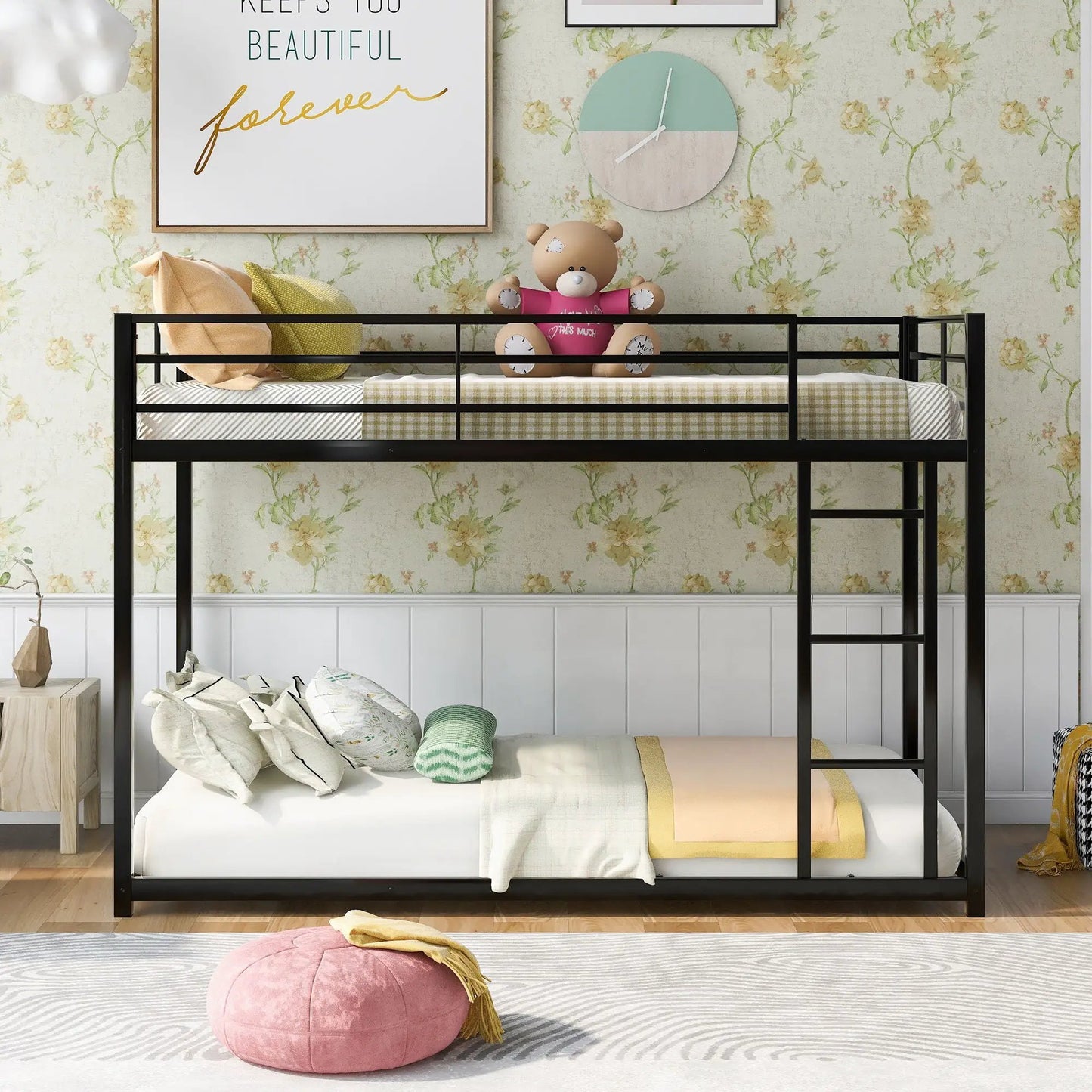 Low black metal bunk bed with ladder in a kid's room, teddy bear sits on the top bunk on Tampa Home & Garden Store