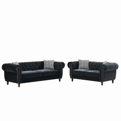 Chesterfield 3- and 2-seat fabric sofas with black tufted upholstery, roll arms and nailhead trim on Tampa Home & Garden Store