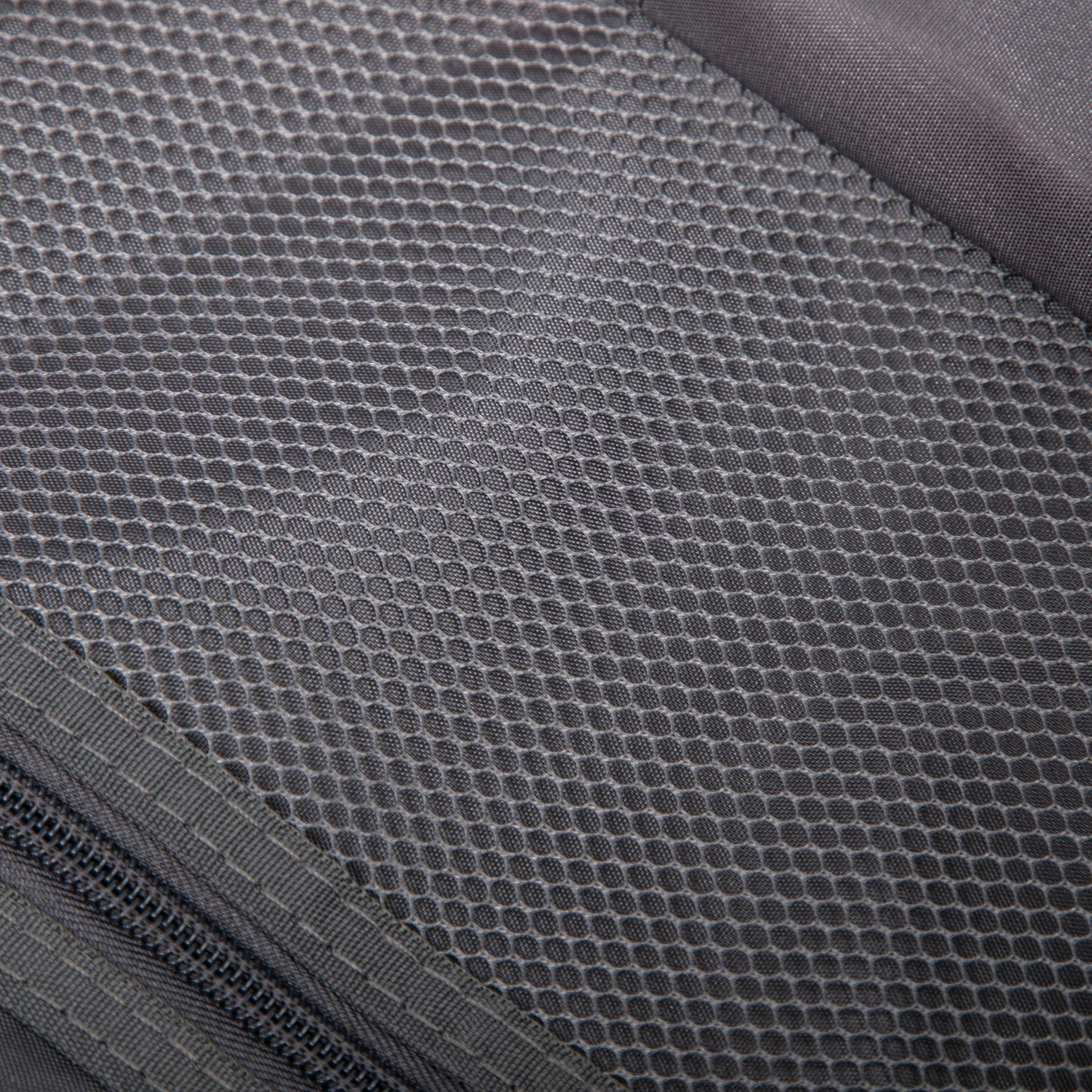 Luggage set fabric close-up in gray with hexagonal honeycomb weave texture on Tampa Home & Garden Store
