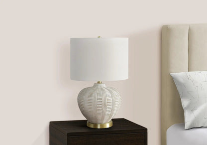 Table lamp resin cream with ribbed resin base and white shade on nightstand on Tampa Home & Garden Store