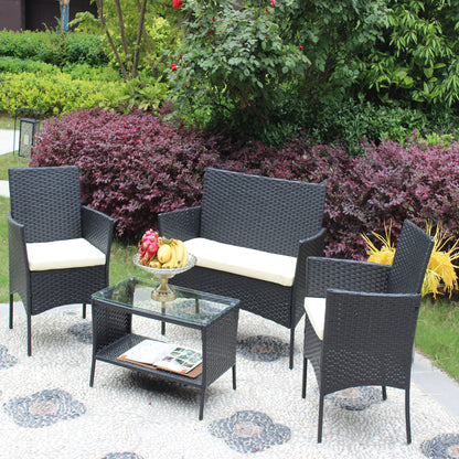 4 pc rattan patio furniture set with black wicker chairs and white cushions around glass coffee table on Tampa Home & Garden Store