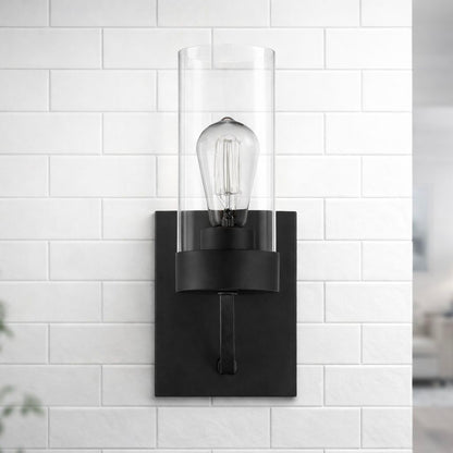 Zephyr single light sconce in black metal with clear glass cylinder shade by HouseOfZazla on Tampa Home & Garden Store
