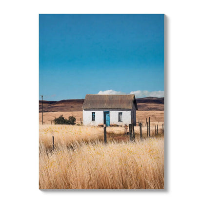 Canvas Art white house in a natural rural field with blue doors and windows under a blue sky on Tampa Home & Garden Store