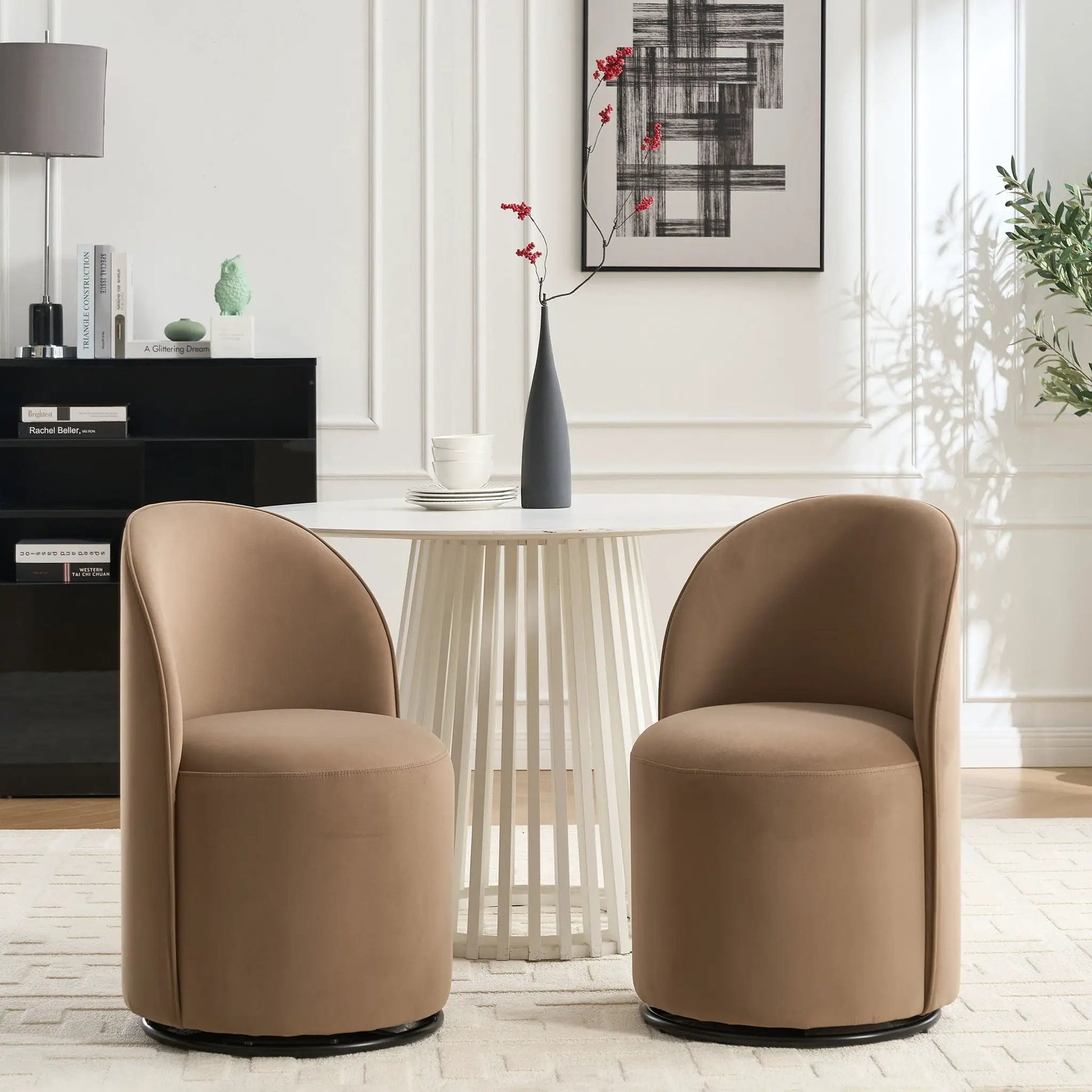 Pair of tan 360 Degree Swivel Armless Dining Barrel Chairs by Unique Piece Furniture with black pedestal bases on Tampa Home & Garden Store