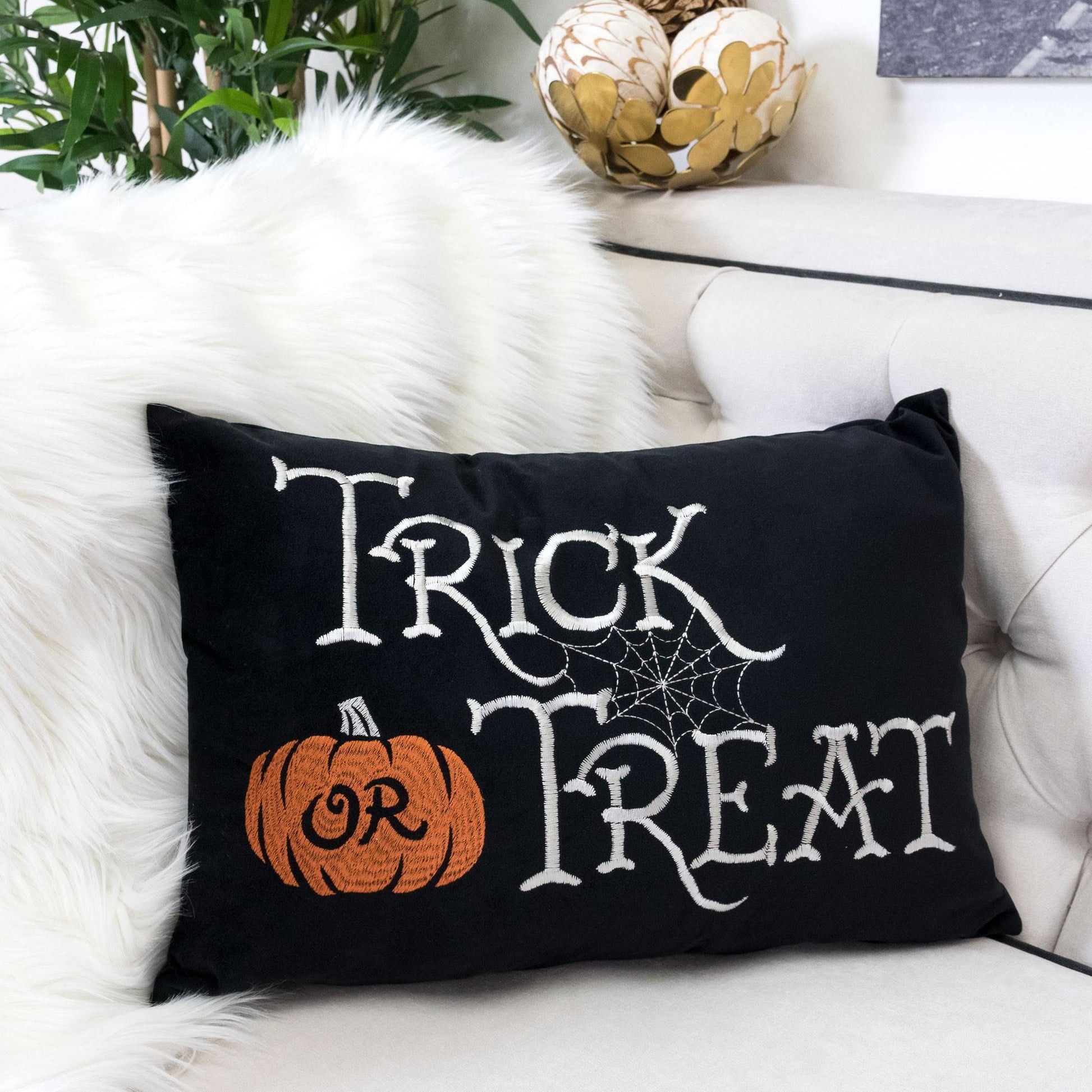 Halloween lumbar pillow black with Trick or Treat embroidery and orange pumpkin insert on Tampa Home & Garden Store
