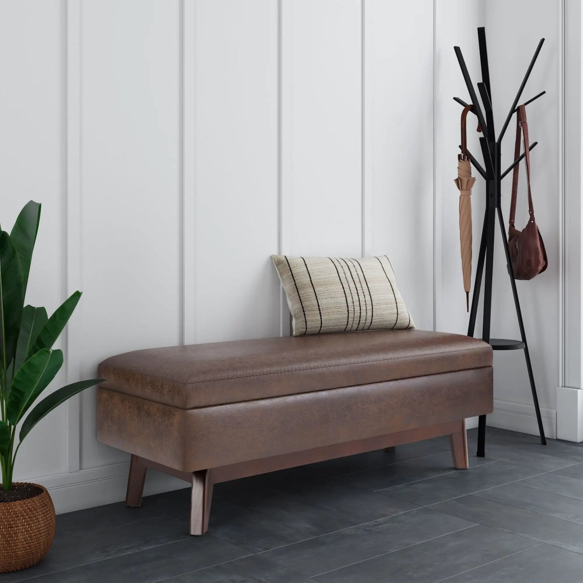 Owen upholstered rectangular storage ottoman in brown faux leather with tapered wooden legs on Tampa Home & Garden Store