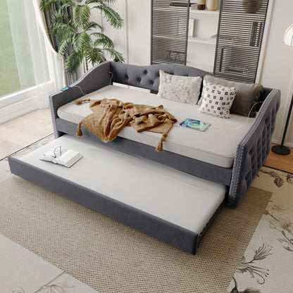Gray twin size upholstered daybed with tufted arms and USB charging, includes trundle on Tampa Home & Garden Store