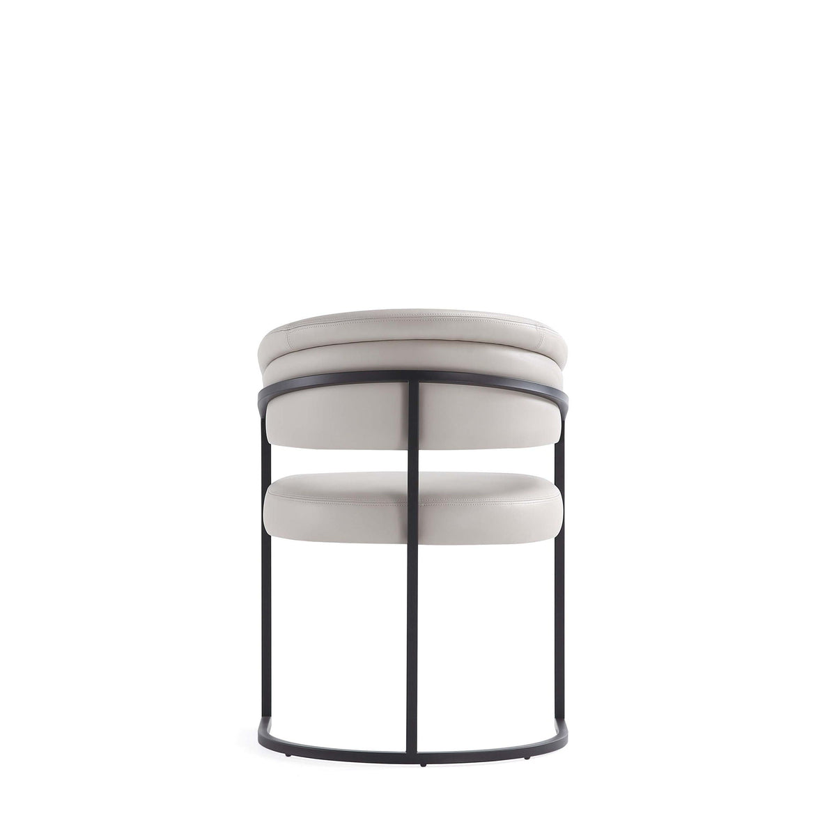 Geometric base dining chair with cream vegan upholstery and black metal frame on Tampa Home & Garden Store