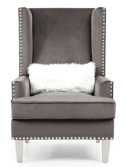 Traditional accent arm chair with deep tufting in dark gray upholstery and nailhead trim on Tampa Home & Garden Store