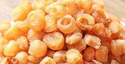 Ring-shaped dried longan pieces, orange-yellow color with hollow centers on Tampa Home & Garden Store