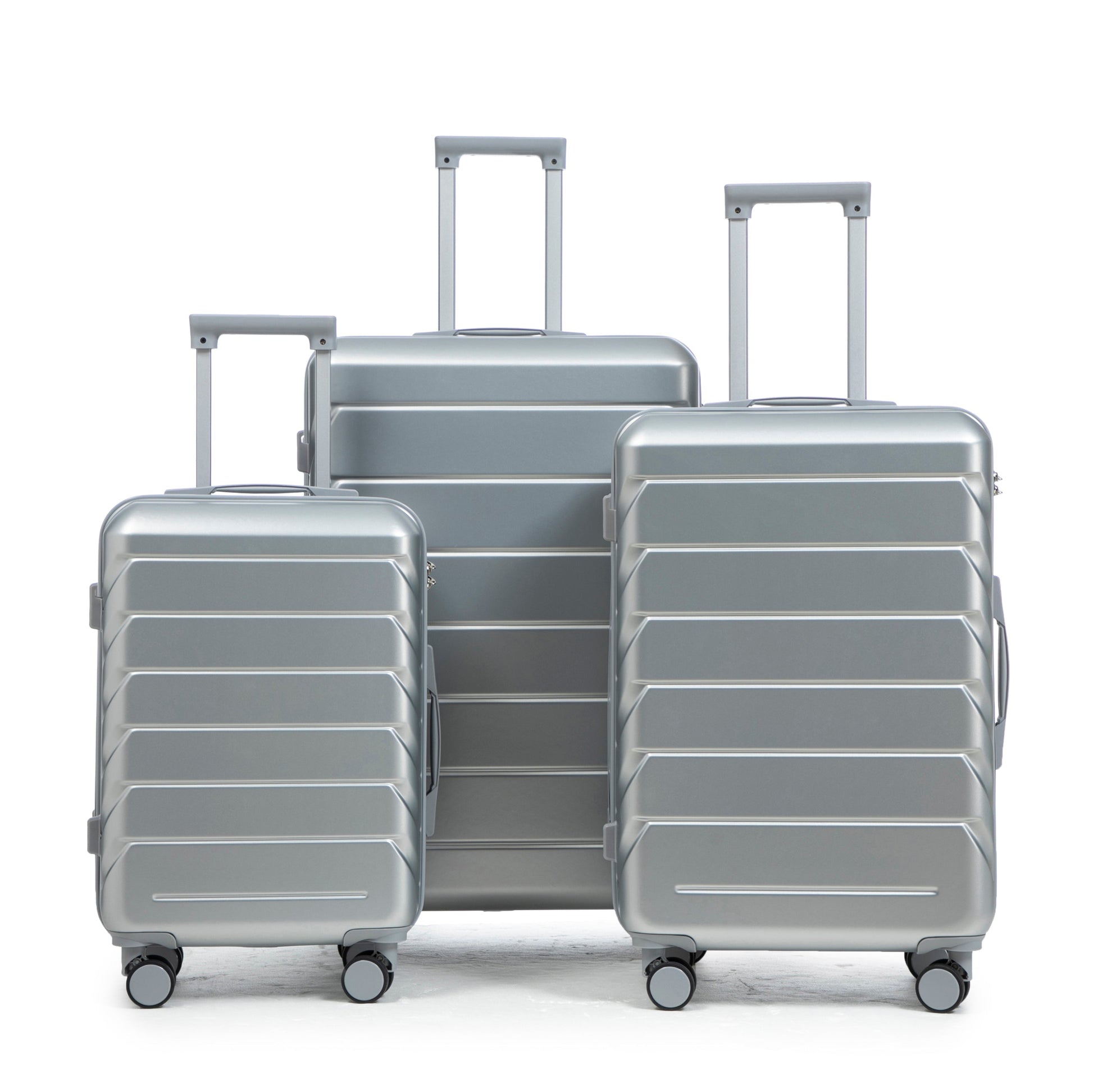 Three-piece ABS spinner luggage set in silver with telescoping handles and wheels on Tampa Home & Garden Store